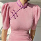 Pink cheongsam. Long skirt with mid-sleeves.