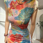 Floral cheongsam. Long skirt with short sleeves.