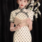 Polka dot cheongsam. Champagne color short-sleeved cheongsam.