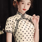 Polka dot cheongsam. Champagne color short-sleeved cheongsam.