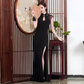 Black openback cheongsam dress.