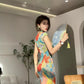 Floral cheongsam. Long skirt with short sleeves.