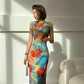 Floral cheongsam. Long skirt with short sleeves.