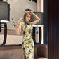 Yellow cheongsam. Floral short-sleeved cheongsam.