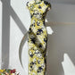 Yellow cheongsam. Floral short-sleeved cheongsam.