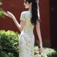 Green cheongsam. Short sleeve cheongsam. Green dress.