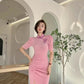 Pink cheongsam. Long skirt with mid-sleeves.