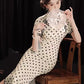 Polka dot cheongsam. Champagne color short-sleeved cheongsam.