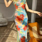 Floral cheongsam. Long skirt with short sleeves.