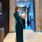 Green sleeveless cheongsam.