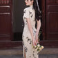 Traditional short-sleeved cheongsam. Floral cheongsam.