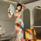 Floral cheongsam. Long skirt with short sleeves.