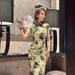 Yellow cheongsam. Floral short-sleeved cheongsam.