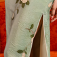 Green jacquard cheongsam. Knee qipao. Silk and polyester blend.