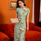 Green jacquard cheongsam. Knee qipao. Silk and polyester blend.