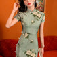 Green jacquard cheongsam. Knee qipao. Silk and polyester blend.