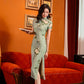 Green jacquard cheongsam. Knee qipao. Silk and polyester blend.