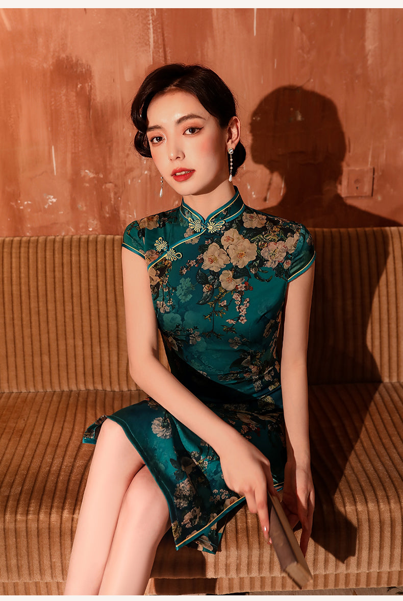 Green knee-length cheongsam dress. Fully lined. Polyester and silk blend.