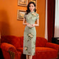 Green jacquard cheongsam. Knee qipao. Silk and polyester blend.