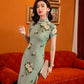 Green jacquard cheongsam. Knee qipao. Silk and polyester blend.