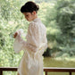 Traditional Chinese white cheongsam wedding dress.