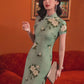 Green jacquard cheongsam. Knee qipao. Silk and polyester blend.